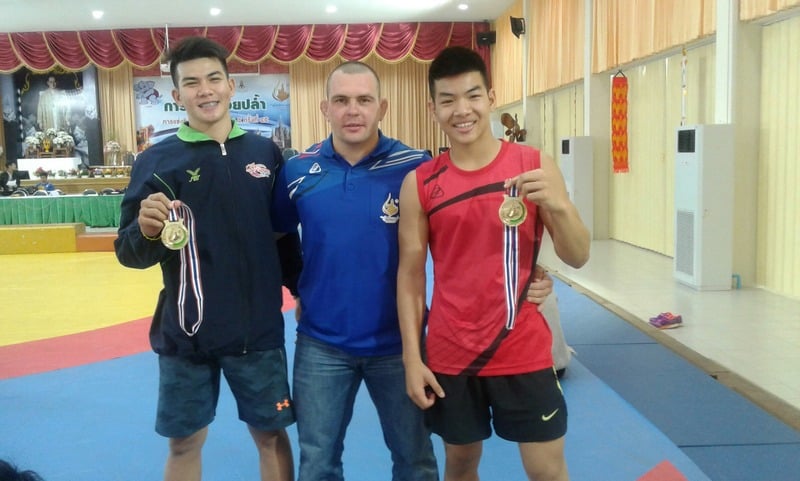 Coach Artem with medal-winning athletes