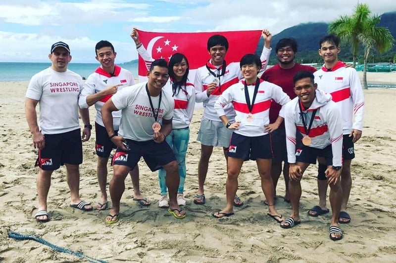Singapore wrestling team group photo on the beach